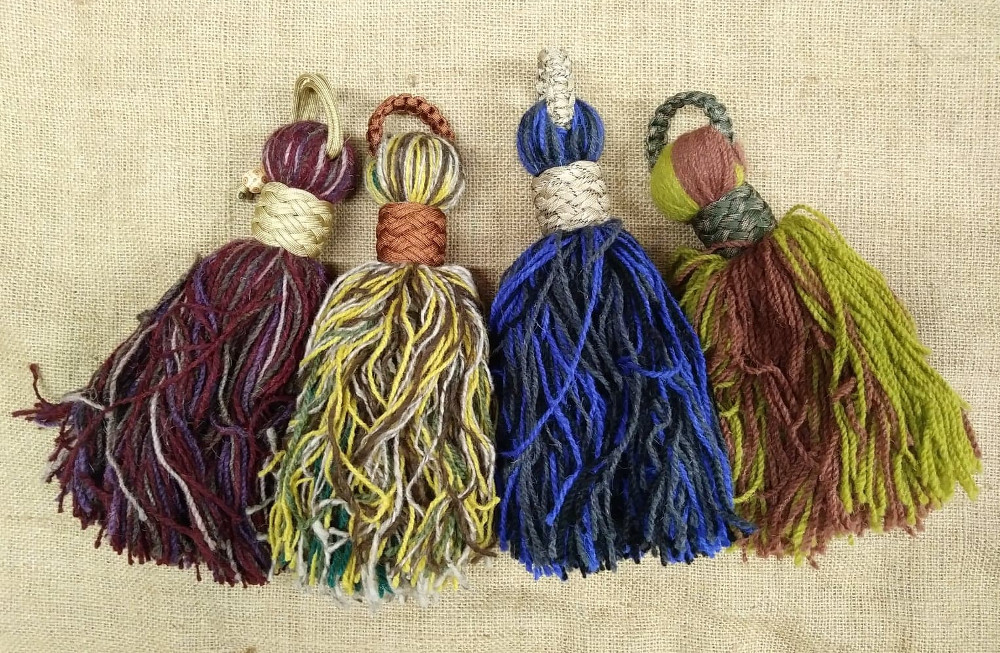 Tassel hand made from pure wool with a braided loop hanger.